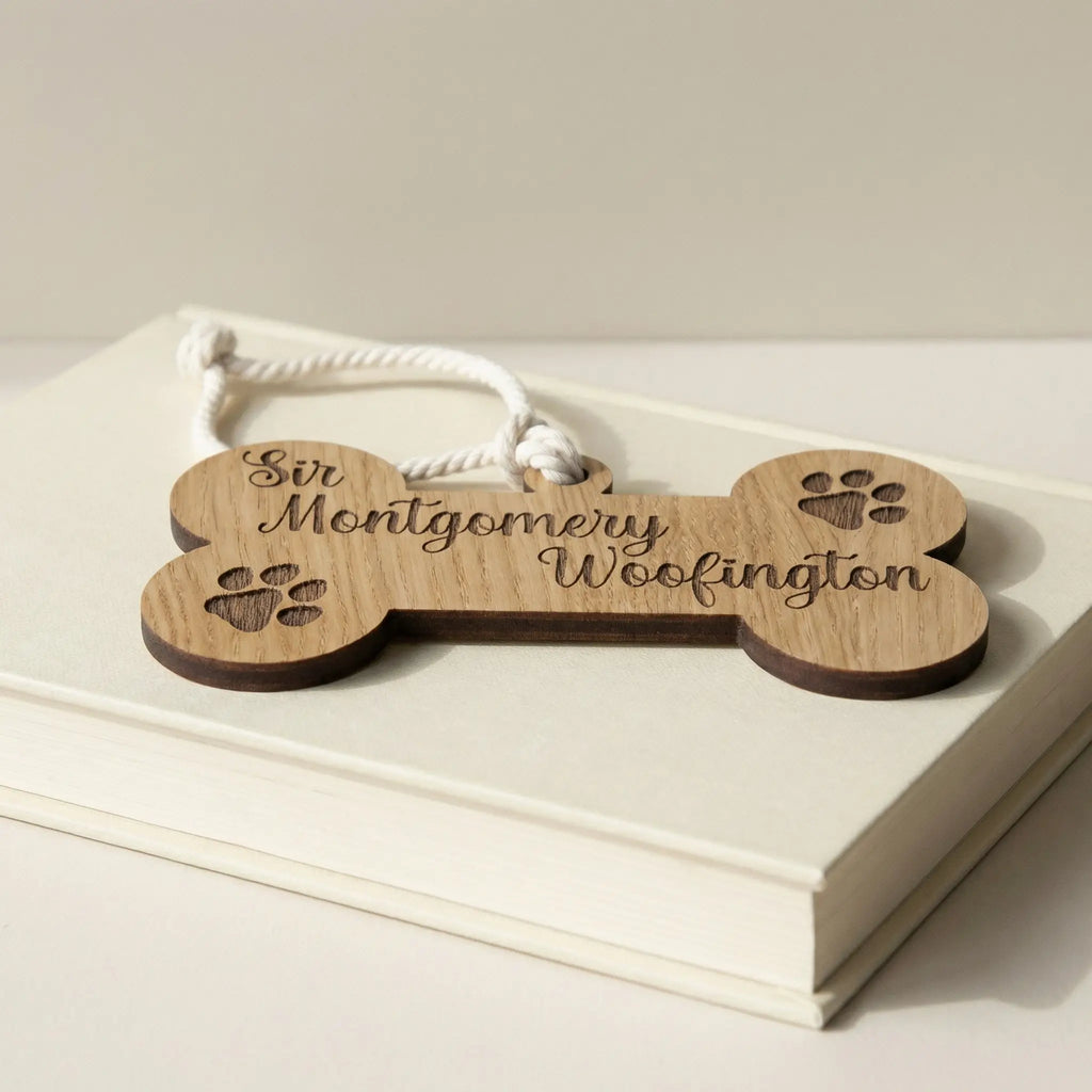 Wooden dog bone plaque resting on books