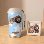 Pet portrait coffee cup beside framed photo