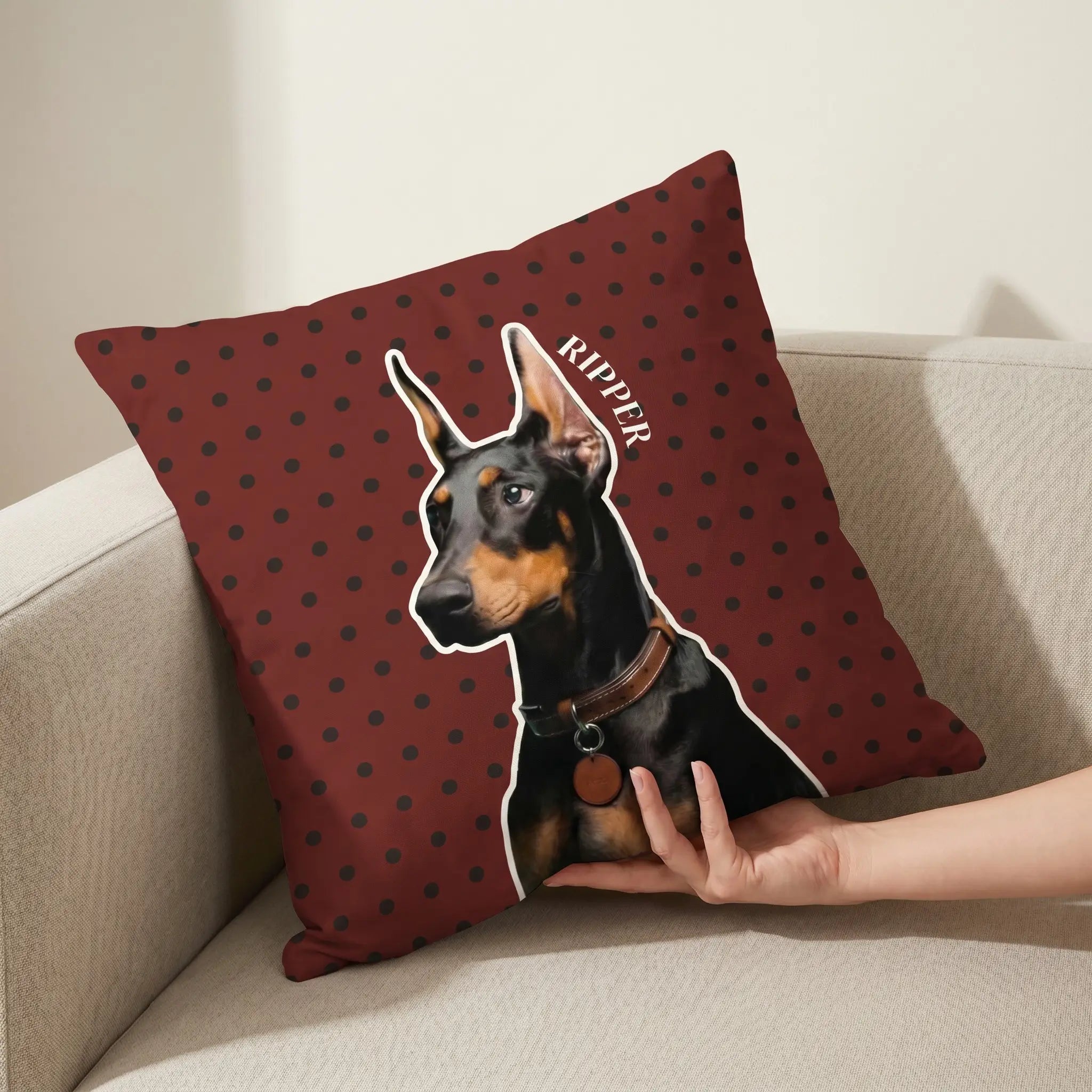 Hand holding custom dog portrait pillow