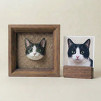 Framed cat sculpture displayed beside pet photo