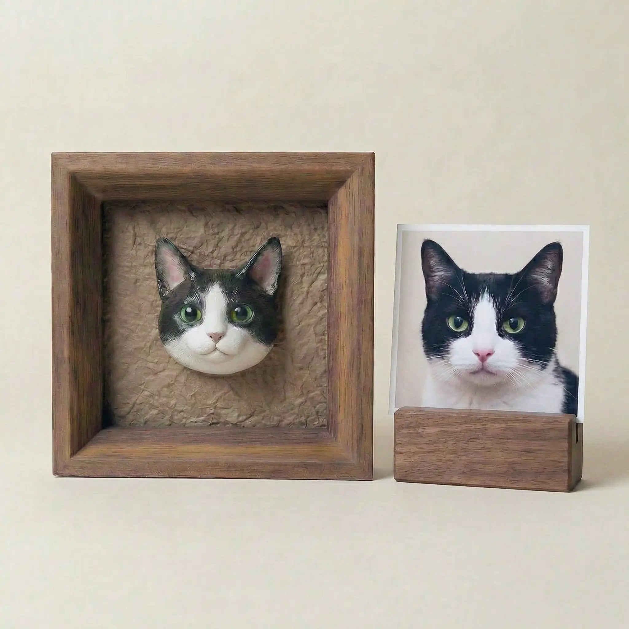 Framed cat sculpture displayed beside pet photo