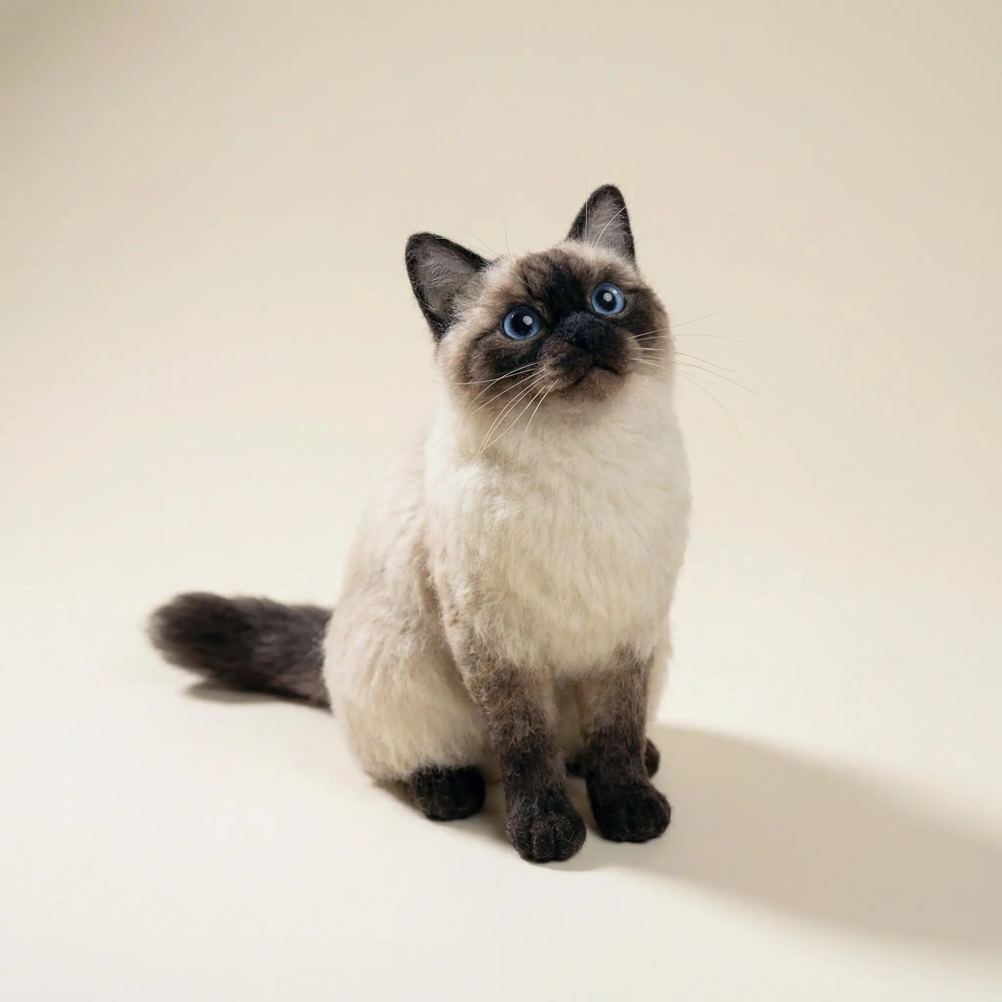 Realistic cat clone sculpture on neutral background