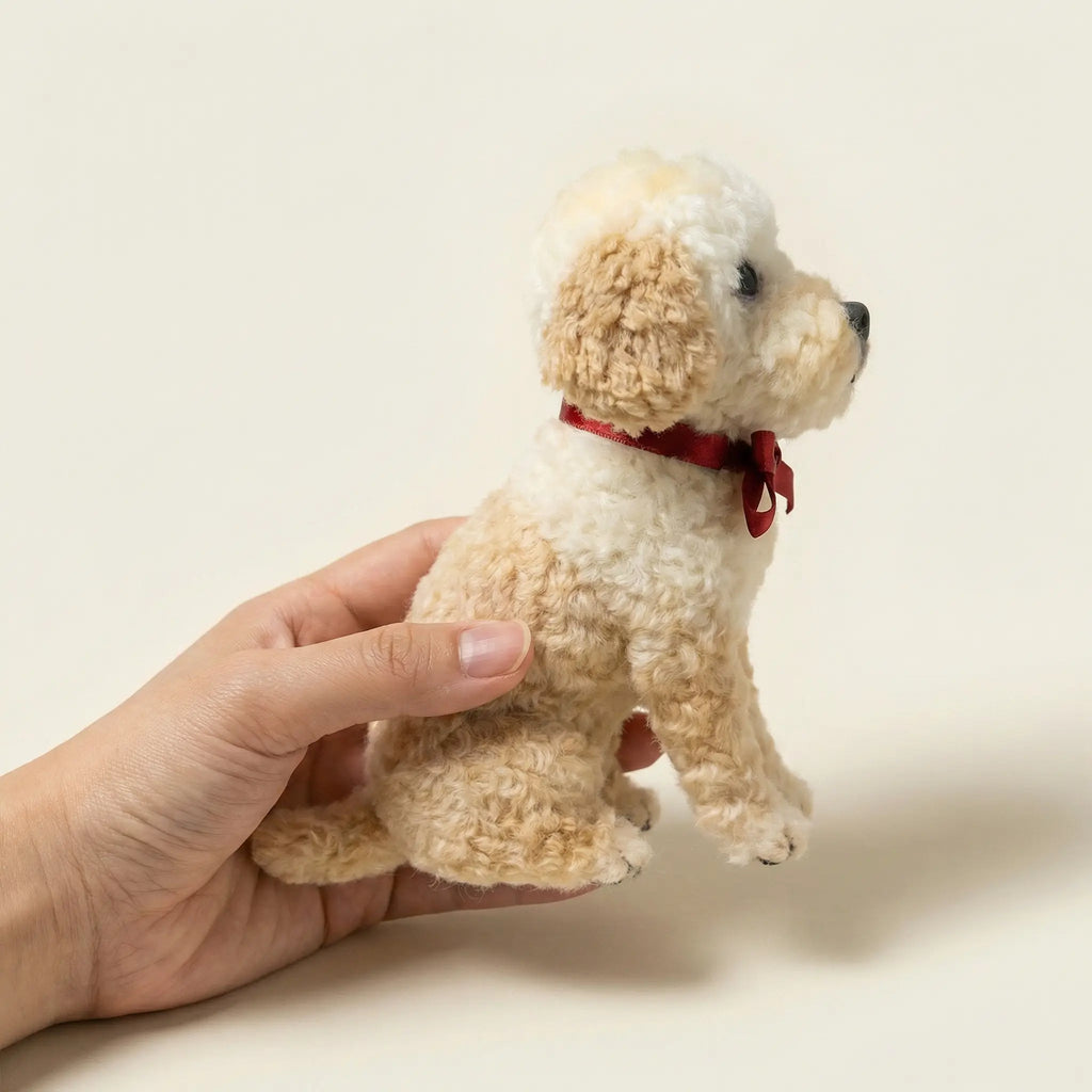 Hand holding realistic dog clone sculpture