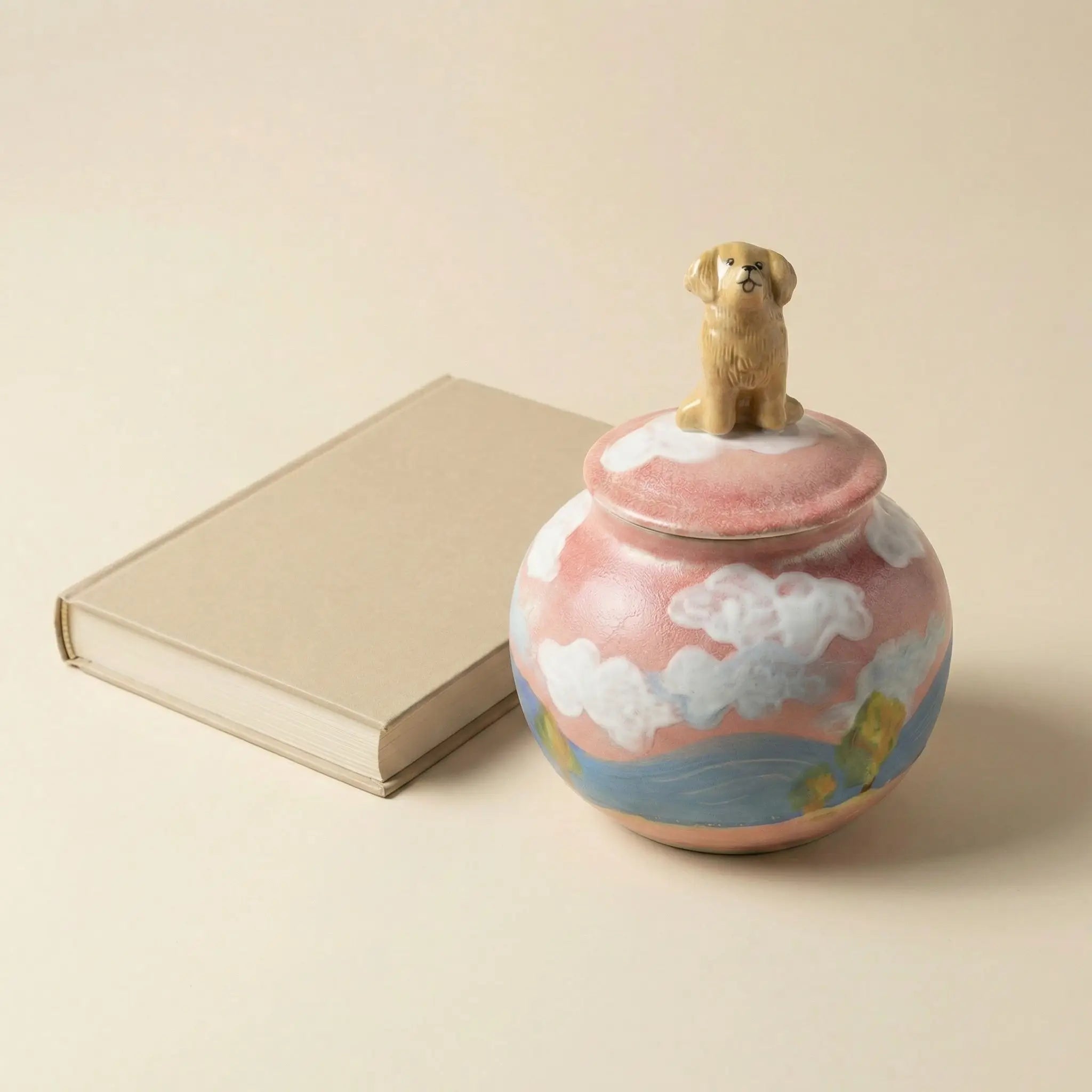 Pet urn displayed beside memorial book