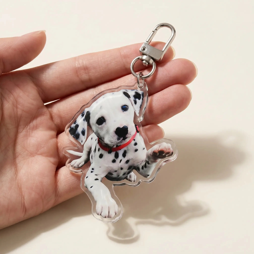 Hand holding acrylic dalmatian keychain