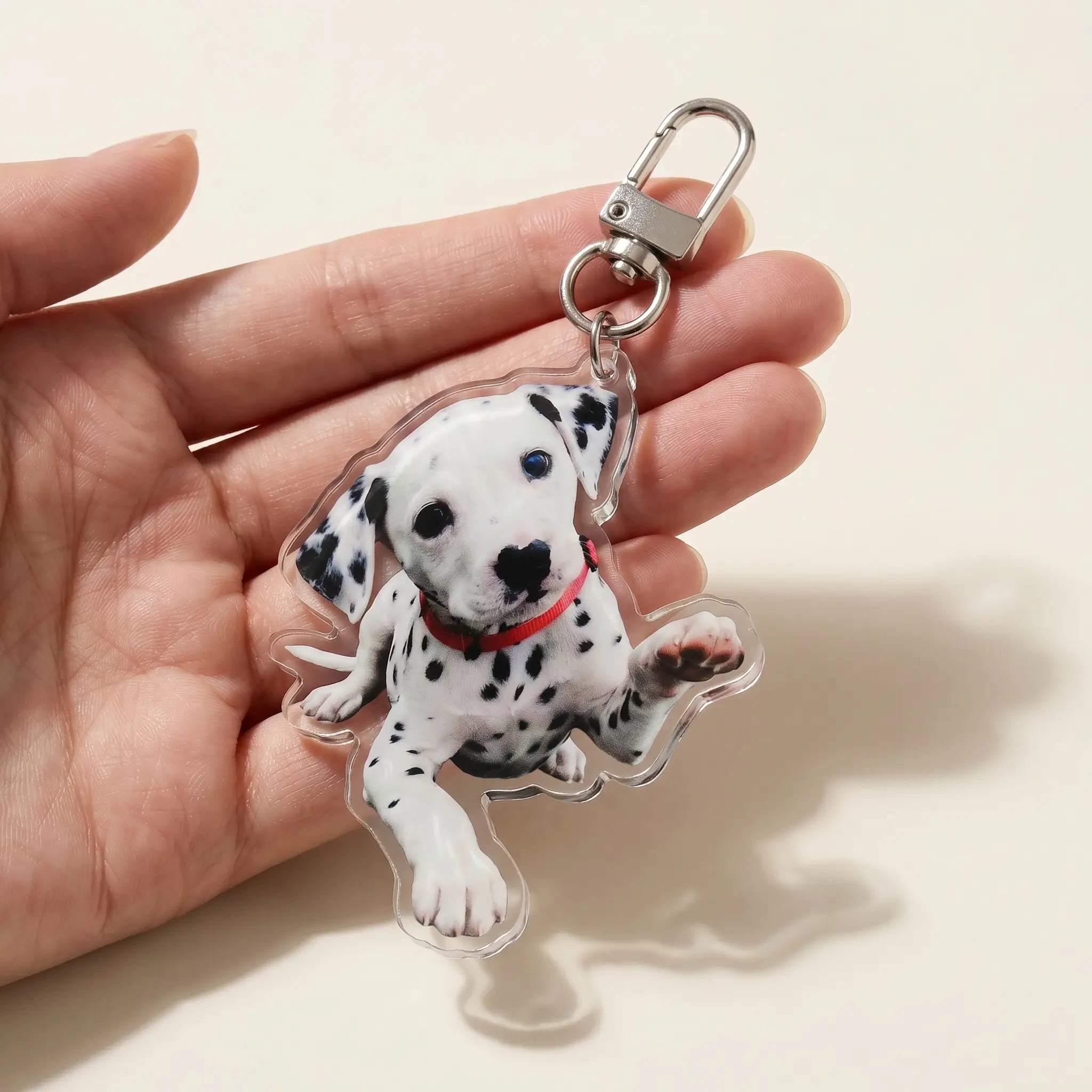 Hand holding acrylic dalmatian keychain