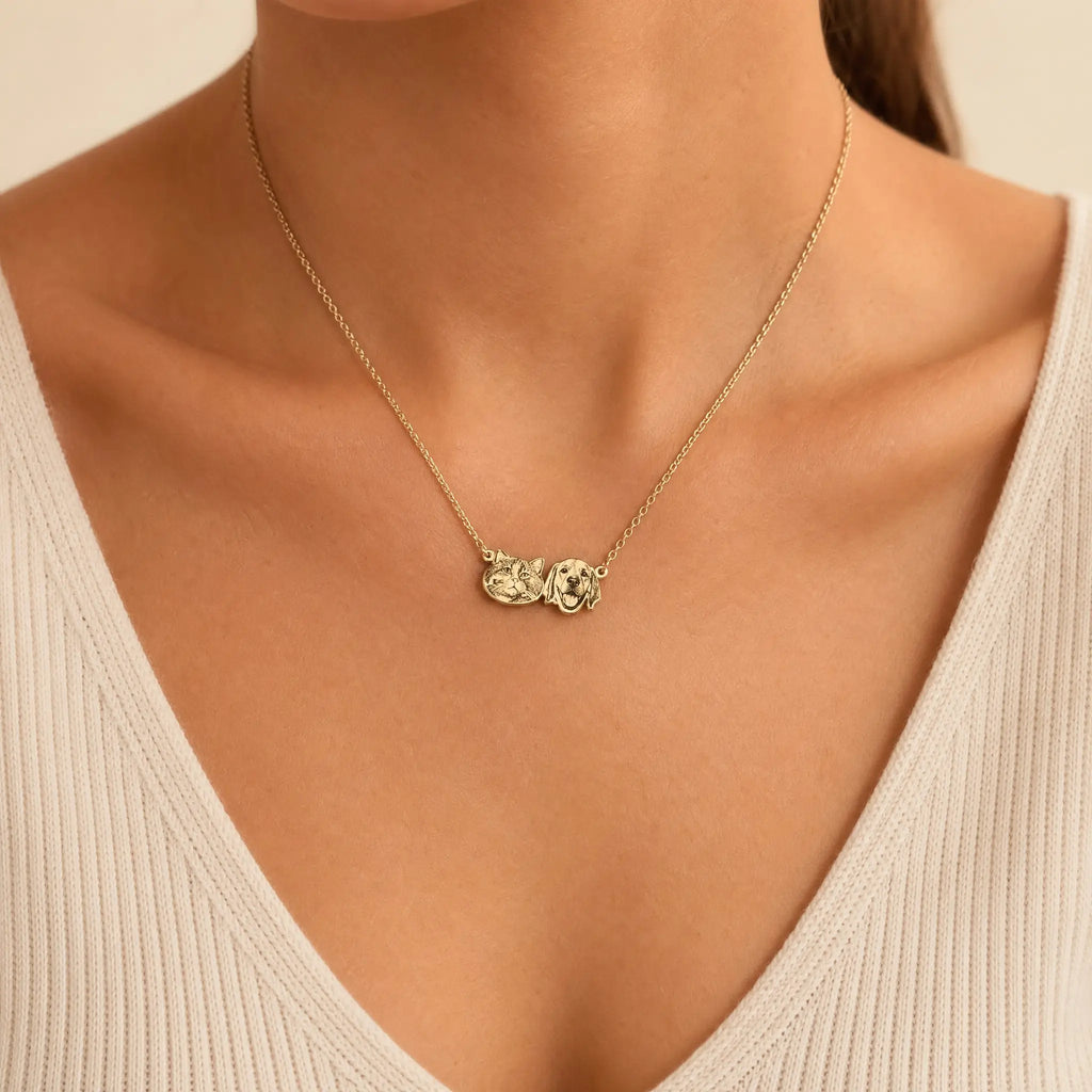 Gold pet pendant necklace worn on neckline
