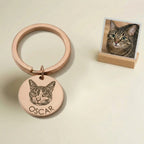 Pet portrait keychain displayed beside cat photo